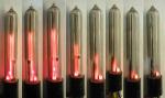 Neon tube for signal strength indication. The tube is usually wired like a regulator gas tube regulating the plate voltage of the IF and/or RF stages. The variation in IF/RF plate current caused by a change in AGC grid bias voltage at the IF/RF stages. This tube was used the FADA radio model RW.